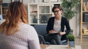 Image of Woman Seeking Promotion with Manager